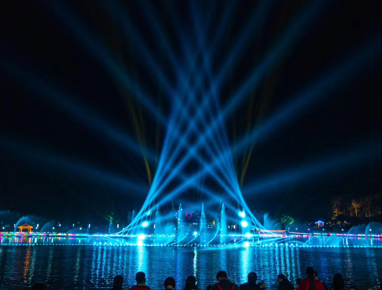 Visitors experiencing a floor-to-ceiling immersive light show